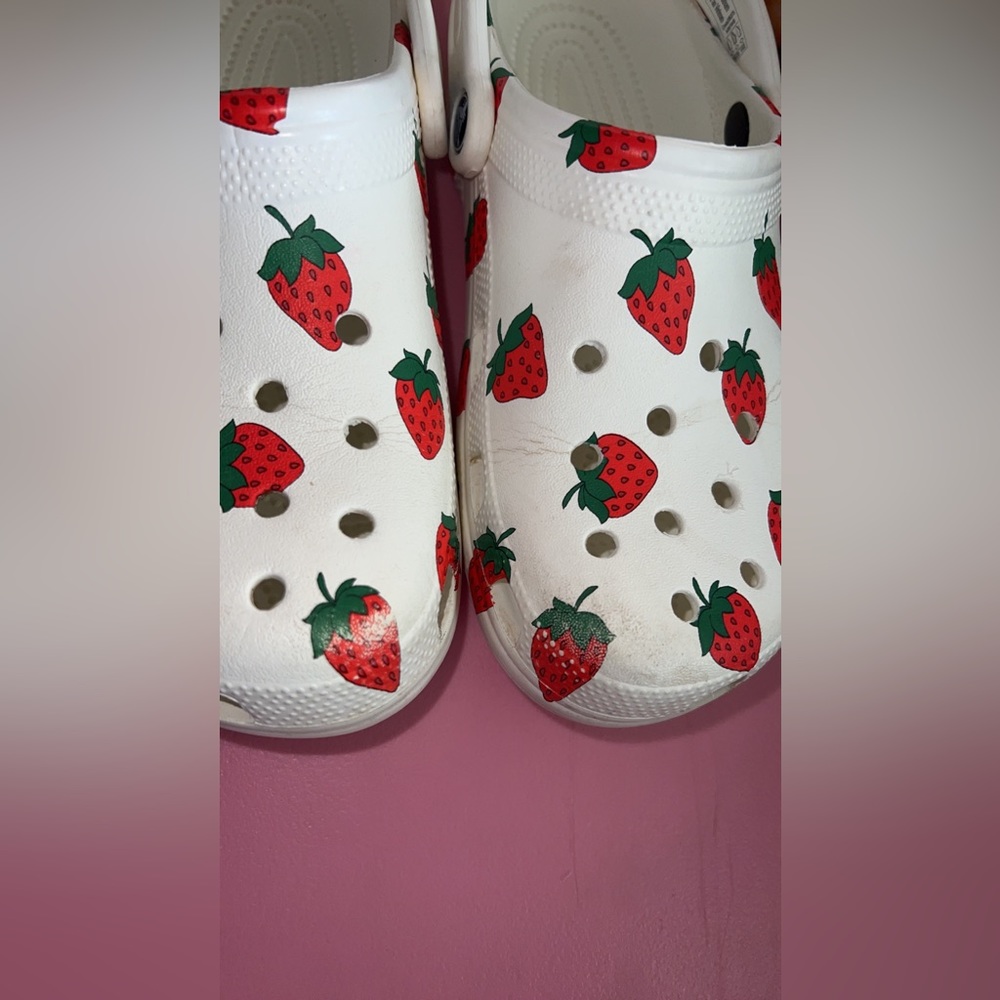 Woman’s strawberry crocs